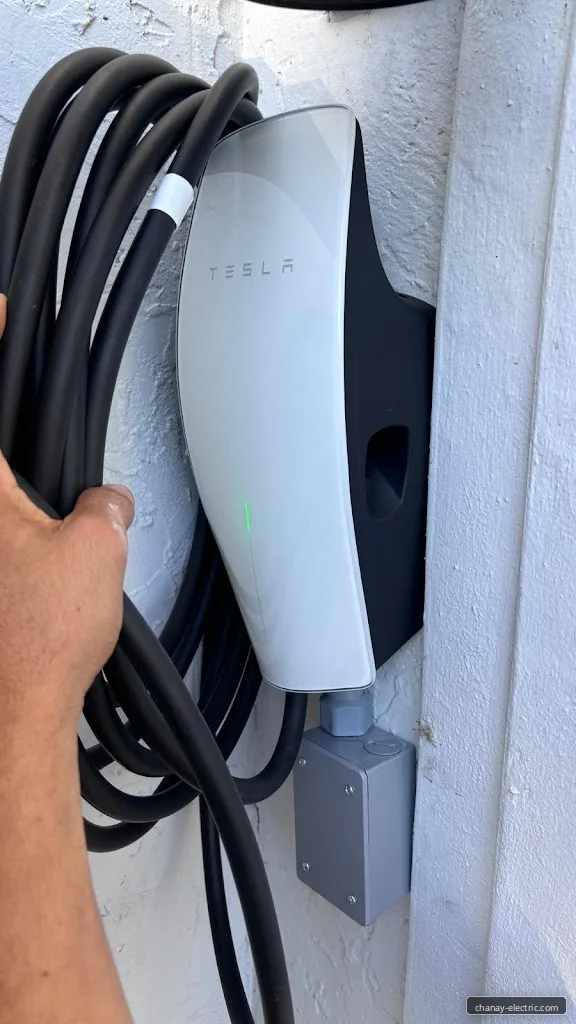 Level 2 EV charger mounted on a home wall